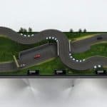 Made to look realistic, the 5 x 16, three-lane, wooden, handcrafted layout exhibits realistically painted track surfaces, trees, shrubs, and apex markers