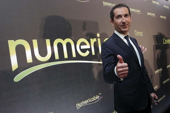 Patrick Drahi, Franco-Israeli businessman, Executice Chairman of cable and mobile telecoms company Altice and founder of Numericable, poses prior to a news conference in Paris
